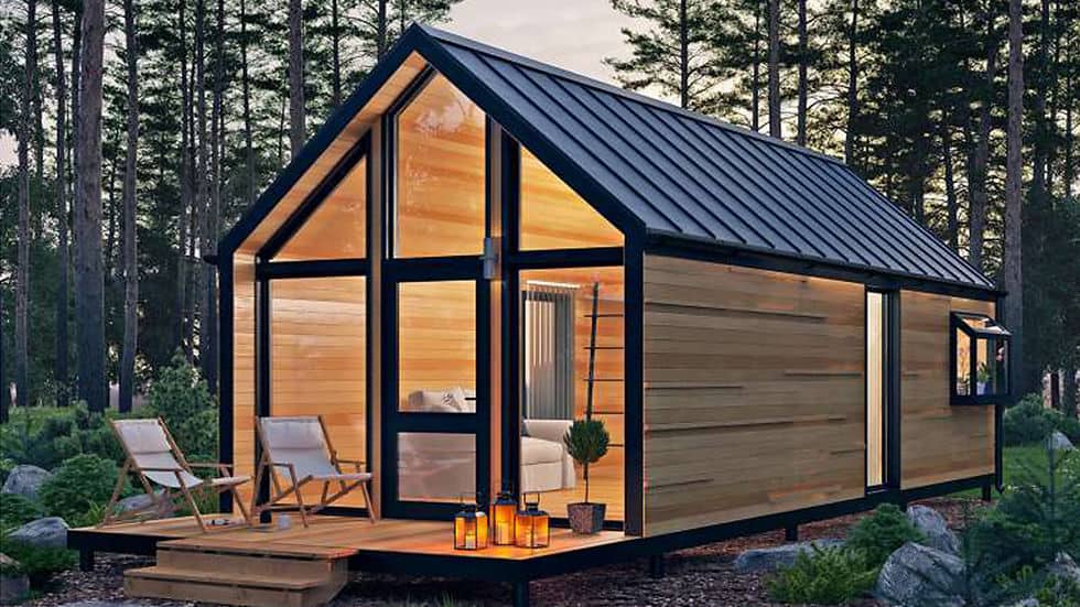 Compact light-steel cabin with modern facade and cantilevered entry deck