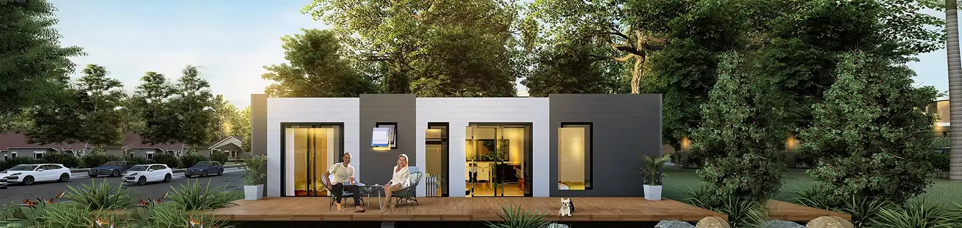 Xpandable modular home exterior at dusk with warm lighting and modern steel structure